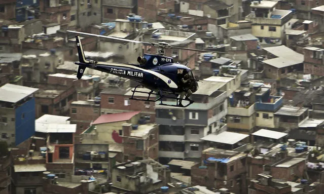 400 officers target gang members in Complexo do Alemao neighborhood as police raid on slum in Rio de Janeiro, Brazil leaves 18 dead on July 21, 2022. At least 18 people were killed in a police raid targeting organized gangs in Brazilâs second largest city of Rio de Janeiro, local media reported Thursday. Those who died in the massive operation carried out by 400 officers in the Complexo do Alemao neighborhood included 16 gang members, one military police officer and one civilian, said the Globo news outlet, citing a press conference held by the police. (Photo by Fabio Teixeira/Anadolu Agency via Getty Images)