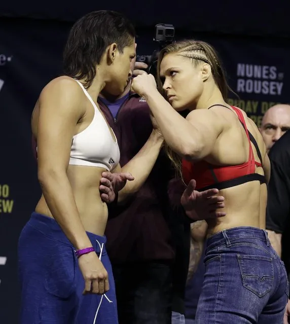 Ronda Rousey, right, and Amanda Nunes face off for photographers during an event for UFC 207, Thursday, December 29, 2016, in Las Vegas. Rousey is scheduled to fight Nunes in a mixed martial arts women's bantamweight championship bout Saturday in Las Vegas. (Photo by John Locher/AP Photo)