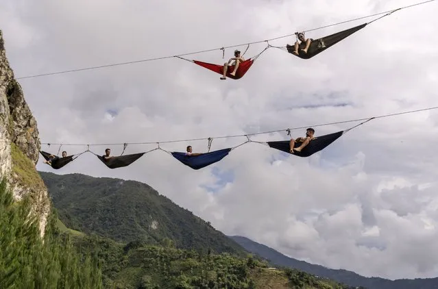 A view of hanging hammocks near the house in the air in Abejorral, Colombia on August 20, 2022. The house in the air is an aero hostel located in the Andes mountains. It is built on a vertical rock about 25 meters high and its visitors can perform different activities such as canopy, high hammock, rock climbing, pendulum while enjoying a magnificent landscape. (Photo by Luis Bernardo Cano/Anadolu Agency via Getty Images)
