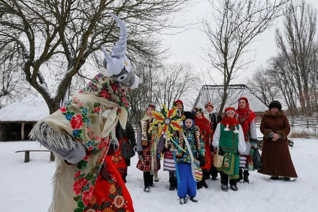 Children dressed in traditional costumes sing Christmas carols as they gather to celebrate Orthodox Christmas at a compound of the National Architecture museum in Kiev, Ukraine January 7, 2017. (Photo by Valentyn Ogirenko/Reuters)