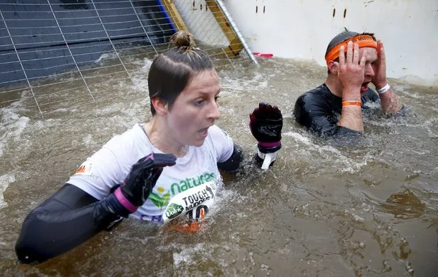 Competitors participate in the Tough Mudder challenge near Henley-on-Thames in southern England May 2, 2015. (Photo by Eddie Keogh/Reuters)