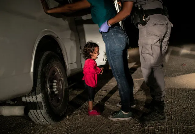 The winner: crying girl on the border, by John Moore. Yanela, from Honduras, cries as her mother, Sandra Sanchez, is searched by a US border patrol agent, in McAllen, Texas, US. This image was also nominated in the “spot news” category. (Photo by John Moore/Getty Images/World Press Photo 2019)
