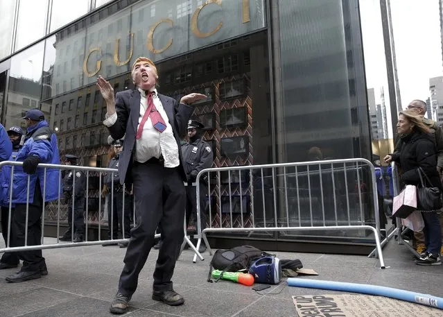 A demonstrator dressed as U.S. Republican presidential candidate Donald Trump protests outside the Trump Tower building in midtown Manhattan in New York March 19, 2016. (Photo by Brendan McDermid/Reuters)