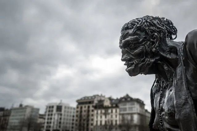 This photograph taken on February 27, 2024 shows a statue of Frankenstein's monster by the Geneva artist group KLAT (Jerome Massard, Florian Saini, Konstantin Sgouridis in the Plainpalais neighbourhood in Geneva. Frankenstein, the story of a scientist who brings to life a cadaver and causes his own downfall, has for two centuries given voice to modern anxiety surrounding science's unrelenting advance. (Photo by Fabrice Coffrini/AFP Photo)
