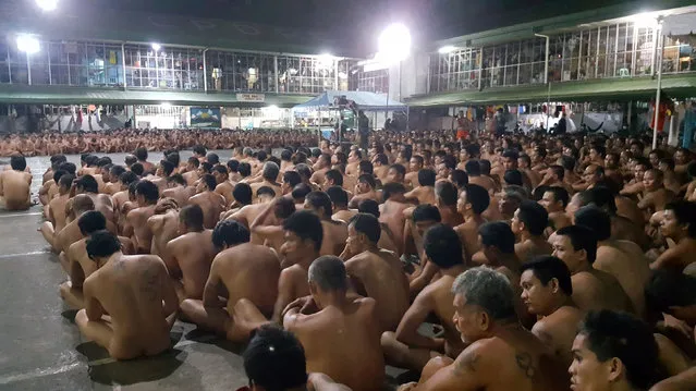 This handout from the Philippine Drug Enforcement Agency- Regional Office 7 (PDEA RO-7) taken on February 28, 2017 and released on March 2, 2017 shows naked inmates at the Cebu city jail sitting during a joint raid by the PDEA and the Cebu Police provincial office on illegal drugs and contraband. .Photos showing hundreds of prisoners in a Philippine jail sitting naked while being searched for contraband have triggered accusations of further rights abuses in President Rodrigo Duterte' s deadly war on drugs. (Photo by AFP Photo)