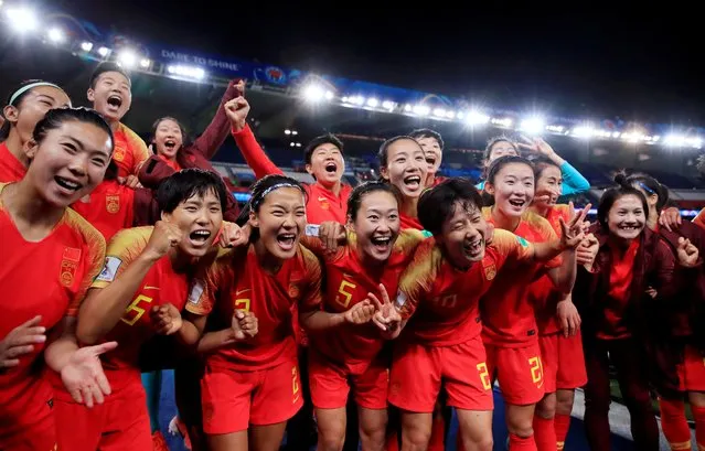 China's players celebrate their victory at the end of the France 2019 Women's World Cup Group B football match between South Africa and China, on June 13, 2019, at the Parc des Princes stadium in Paris. (Photo by Gonzalo Fuentes/Reuters)