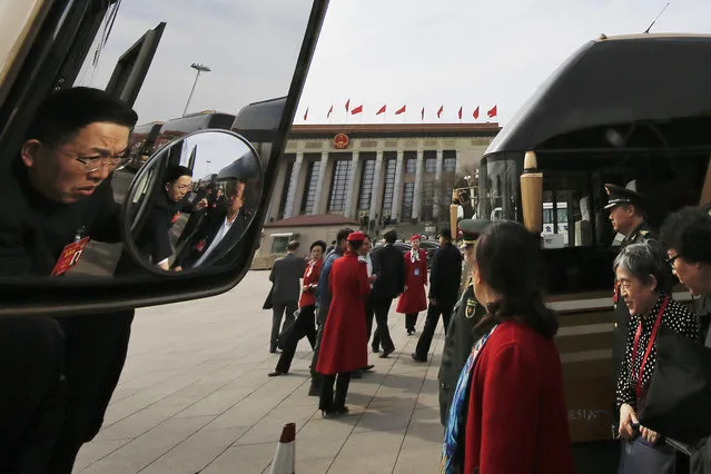 Delegates disembark from buses as they arrive for a plenary session of the Chinese People's Political Consultative Conference (CPPCC) held at the Great Hall of the People in Beijing, Saturday, March 11, 2017. China's top leadership as well as thousands of delegates from around the country are gathered at the Chinese capital for the annual legislature meetings. (Photo by Andy Wong/AP Photo)