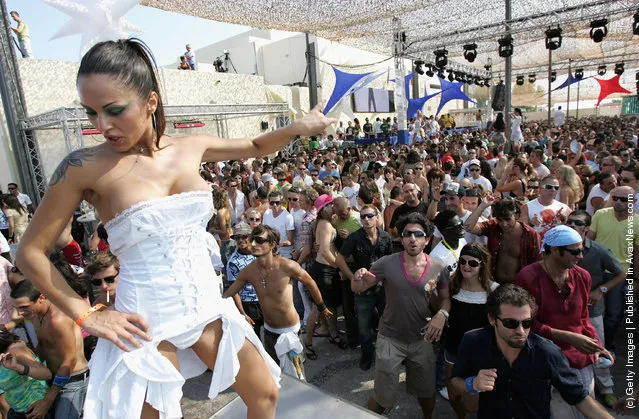 Clubbers dance during the matinee at Space nightclub in Spain Ibiza