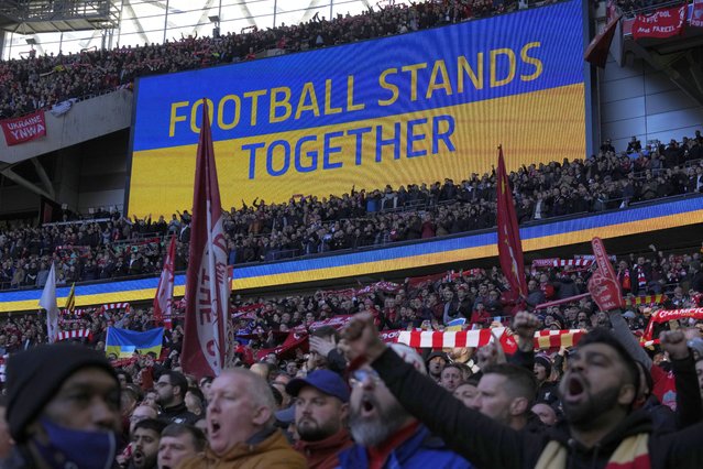 A video screen displays the Ukrainian flag, during the English League Cup final soccer match between Chelsea and Liverpool at Wembley stadium in London, Sunday, February 27, 2022. (Photo by Alastair Grant/AP Photo)