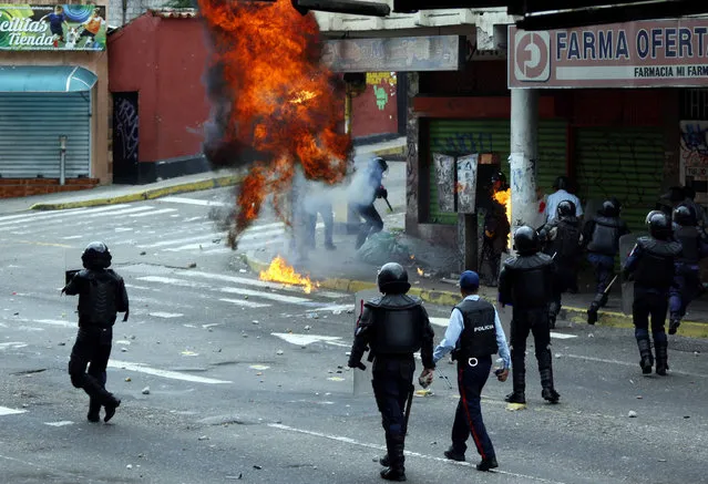  Opposition supporters clash with police during protests against unpopular leftist President Nicolas Maduro in San Cristobal, Venezuela April 19, 2017. (Photo by Carlos Eduardo Ramirez/Reuters)