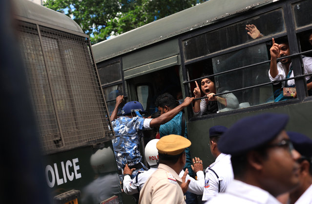 Teaching candidates and job aspirants shout slogans as they are being detained by police during a protest against the West Bengal Chief Minister over an alleged recruitment scam and to demand jobs in Kolkata, eastern India, 08 July 2024.The protest aims to raise awareness of the alleged corruption within the education system that saw almost 26,000 teachers and staff bribe their way through a 2016 state-sponsored test. Kolkata High Court declared the entire panel of 2016 School Service Commission teachers' recruitment null and void, cancelling all appointments of teachers and non-teaching staff. (Photo by Piyal Adhikary/EPA/EFE)