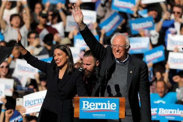U.S. Rep. Alexandria Ocasio-Cortez (D-NY) introduces Democratic 2020 U.S. presidential candidate and U.S. Senator Bernie Sanders (I-VT) during the “Bernie's Back” rally at Queensbridge Park in the Queens Borough of New York City, U.S., October 19, 2019. (Photo by Andrew Kelly/Reuters)