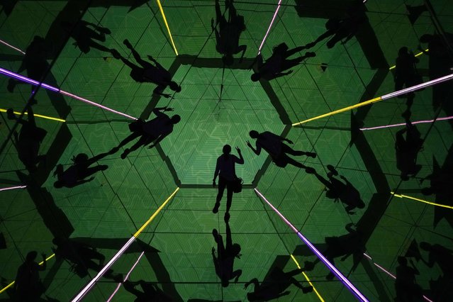 A visitor is seen in a kaleidoscope room as a part celebrations marking the 50th anniversary of Hello Kitty at Central shopping mall in Bangkok, Thailand, Wednesday, August 28, 2024. (Photo by Sakchai Lalit/AP Photo)