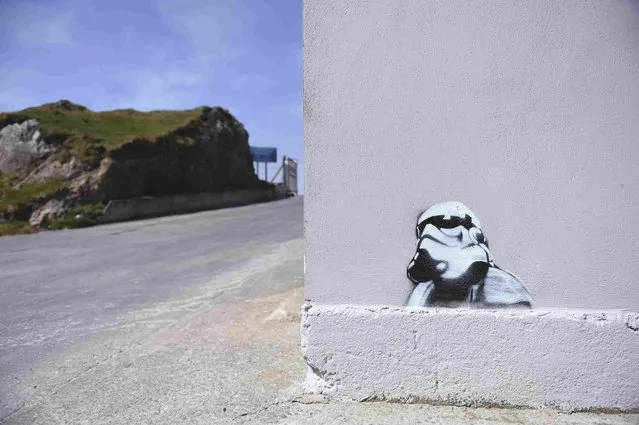 Graffiti of a Storm Trooper from Star Wars is seen on the pier in Malin Head in Ireland, May 11, 2016. (Photo by Clodagh Kilcoyne/Reuters)