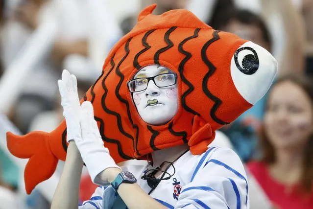 A spectator in fancy dress watches the morning swimming heats during the Aquatics World Championships in Kazan, Russia  August 3, 2015. (Photo by Stefan Wermuth/Reuters)