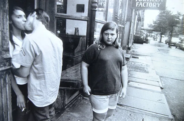 Couple Kissing, Girl Staring at Camera, Tortilla Factory, New York. (Photo by Garry Winogrand)
