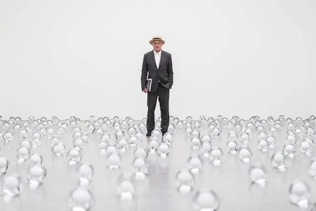 Swiss Artist Not Vital poses in his artwork “700 Snowballs”, at the Buendner Kunstmuseum during the press preview of the “NOT VITAL. univers privat” exhibition in Chur, Switzerland, Friday. September 8, 2017. The exhibition runs from September 9 to Nov. 11, 2017. (Photo by Ennio Leanza/Keystone via AP Photo)