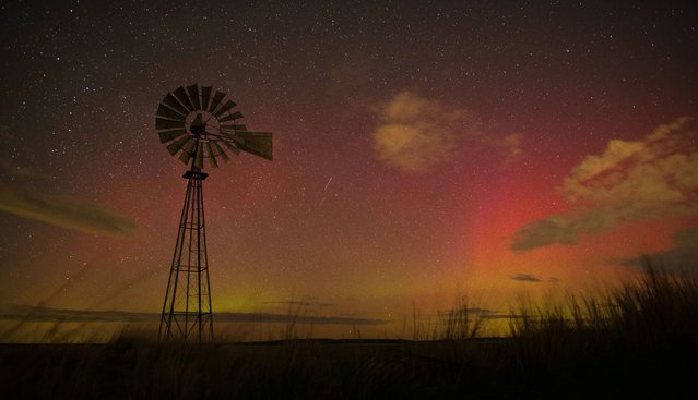The northern skies glow punk and orange with the aurora borealis near Walla Walla, Wash., Wednesday night, March 30, 2022. The display in the sky is due to a recent strong geomagnetic storm from the sun. (Photo by Greg Lehman/Walla Walla Union-Bulletin via AP Photo)