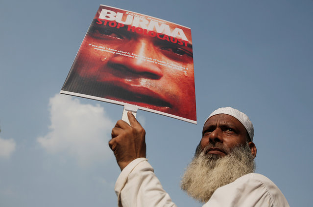 A demonstrator holds a placard during a protest against what demonstrators say are the killing of the Rohingya people in Myanmar, in New Delhi, September 13, 2017. (Photo by Adnan Abidi/Reuters)