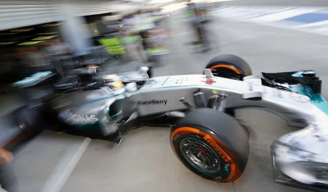 Mercedes Formula One driver Lewis Hamilton of Britain leaves the pit during the third practice session of the Italian F1 Grand Prix in Monza September 6, 2014. (Photo by Stefano Rellandini/Reuters)