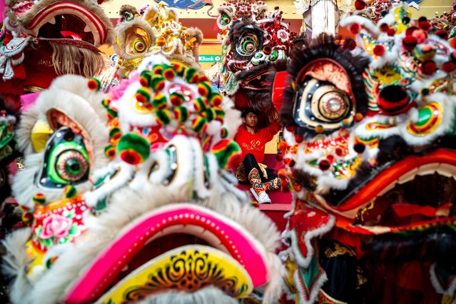 Lion dancers perform on the eve of Lunar New Year at a department store in Bangkok, Thailand, on January 28, 2025. (Photo by Athit Perawongmetha/Reuters)