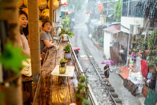 A view of popular train street in the old quarter of Hanoi, Vietnam on July 30, 2022. (Photo by Chris Humphrey/Anadolu Agency via AFP Photo)
