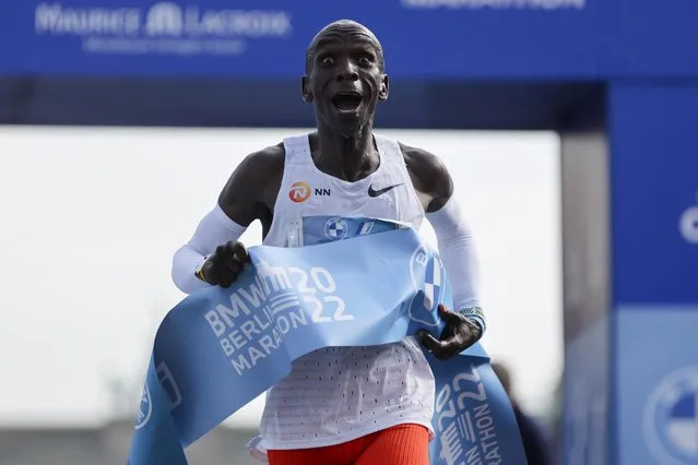 Kenya's Eliud Kipchoge crosses the line to win the Berlin Marathon in Berlin, Germany, Sunday, September 25, 2022. Olympic champion Eliud Kipchoge has bettered his own world record in the Berlin Marathon. Kipchoge clocked 2:01:09 on Sunday to shave 30 seconds off his previous best-mark of 2:01:39 from the same course in 2018. (Photo by Christoph Soeder/AP Photo)