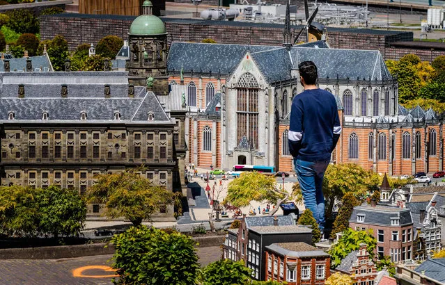 A visitor walks through the miniature theme park Madurodam after its reopening following the outbreak of the coronavirus pandemic, in The Hague, The Netherlands, on May 18, 2020. (Photo by Bart Maat/ANP/AFP Photo)