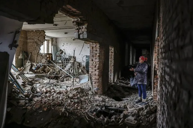 Local resident Irina, 55, inside the destroyed vocational school where she worked for 30 years, in Arkhanhelske, in the northern Kherson region, 06 November 2022. The city of Kherson on the Black Sea coast was seized by Russia in the first month after its invasion of Ukraine on 24 February. Now it appears that Russia might be about to give up at least part of it as it prepares defensive lines for the winter. (Photo by Hannibal Hanschke/EPA/EFE/Rex Features/Shutterstock)