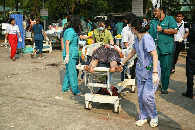 Medical workers transport an earthquake casualty in the compound of a hospital in Naypyidaw on March 28, 2025, after an earthquake in central Myanmar. (Photo by Sai Aung Main/AFP Photo)