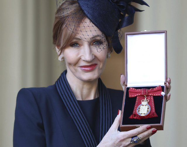 The author of the Harry Potter books,  JK Rowling poses after she was made a Companion of Honour during an Investiture ceremony at Buckingham Palace in London, Tuesday December 12, 2017.  The Duke of Cambridge conducted the investiture for the honour. (Photo by Andrew Matthews/Pool via AP Photo)