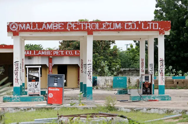 A petrol station, which was once taken over by Boko Haram militants, is pictured with writings by the militants in Bama, Borno State, Nigeria, August 31, 2016. (Photo by Afolabi Sotunde/Reuters)