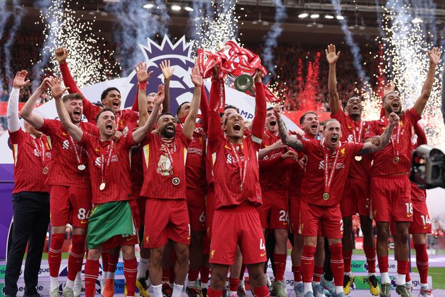 Virgil van Dijk of Liverpool, lifts the Premier League trophy after his team's victory in the Premier League match between Liverpool FC and Crystal Palace FC at Anfield on May 25, 2025 in Liverpool, England. (Photo by Carl Recine/Getty Images)
