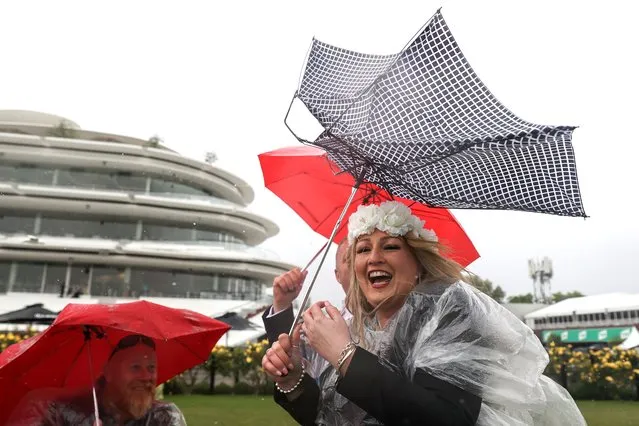 Racegoers brave the conditions during 2022 Melbourne Cup Day at Flemington Racecourse on November 1, 2022 in Melbourne, Australia. (Photo by Martin Keep/Getty Images for VRC)
