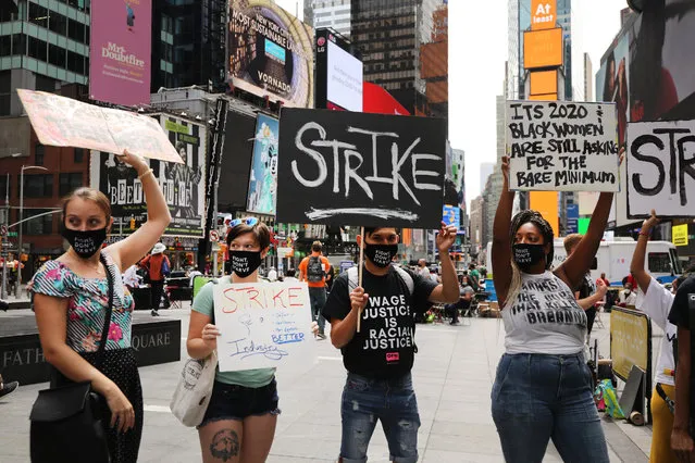 Activists from One Fair Wage hold a demonstration in Times Square to demand a “fair wage” for tipped workers during coronavirus and beyond on August 31, 2020 in New York City. Demanding that all employers pay the full minimum wage with fair, non-discriminatory tips on top, the One Fair Wage campaign seeks to lift millions of tipped and sub minimum wage workers nationally out of poverty. According to the group, the restaurant industry includes 7 of the 10 lowest paying jobs in the country. (Photo by Spencer Platt/Getty Images)