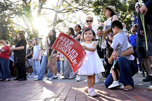 People gather and listen to speeches during a march in solidarity for a peaceful interfaith Prayer Walk for Family Unity Wednesday, June 18, 2025, in Los Angeles. (Photo by Wally Skalij/AP Photo)