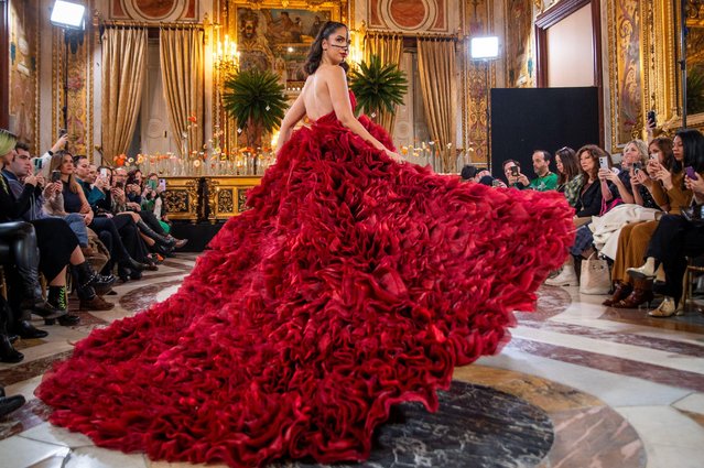 A model shows off a striking scarlet ruffled dress by the designer Jordi Dalmau, at the unveiling of his 2025 collection in Madrid, Spain on March 13, 2024. (Photo by Oscar Manuel Sanchez/ZUMA Press Wire/Alamy Live News)