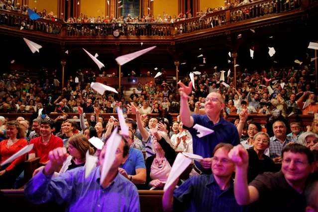 Audience members throw paper airplanes at the stage during the 26th First Annual Ig Nobel Prize ceremony at Harvard University in Cambridge, Massachusetts, U.S. September 22, 2016. (Photo by Brian Snyder/Reuters)
