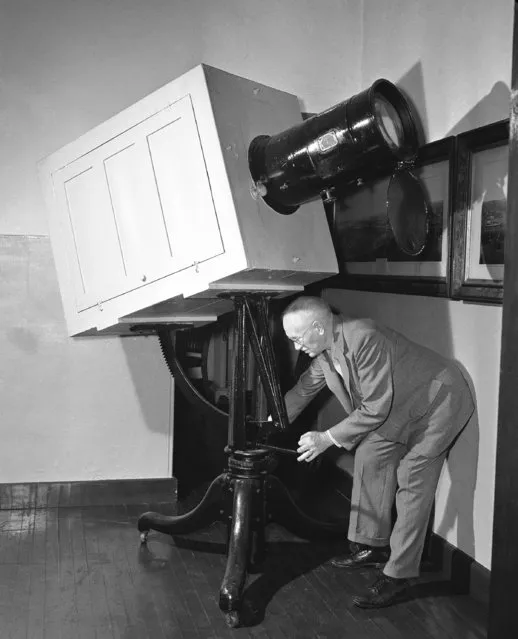 Dr. A.J. Olmstead of the Smithsonian Institution, adjusts the only known example of a “Woodward Solar Camera” in Washington, D.C., October 24, 1944. The camera, manufactured between 1857 and 1877 was the first means available to commercial photographers to make enlargements on the then slow bromide paper, using the sun as a source of illumination. Miss Edna Billings of Racine, Wis., found the camera in a shed near her home while searching for metal for the nation's scrap drive. (Photo by Robert Clover/AP Photo)