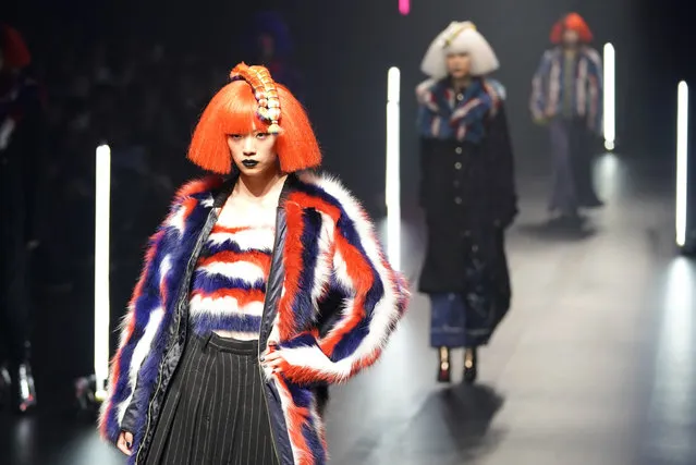 Model display creations by Chinese born Viviano Sue during the 2018 Autumn/Winter Collection at the Tokyo Fashion Week in Tokyo, Wednesday, March 21, 2018. (Photo by Shizuo Kambayashi/AP Photo)