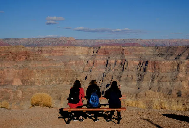 Tourists look at the view from Guano Point on the west rim of the Grand Canyon on the Hualapai Indian Reservation, Arizona, U.S.  February 28, 2018.  Picture taken February 28, 2018. (Photo by Darrin Zammit Lupi/Reuters)