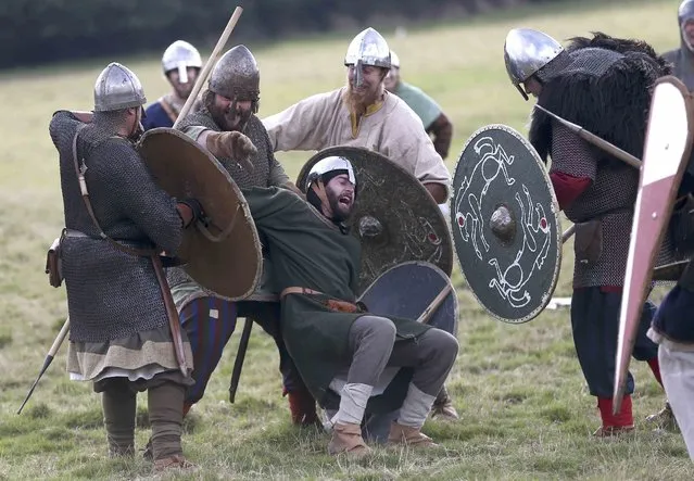 Re-enactors participate in a re-enactment of the Battle of Hastings, commemorating the 950th anniversary of the battle, in Battle, Britain October 15, 2016. (Photo by Neil Hall/Reuters)