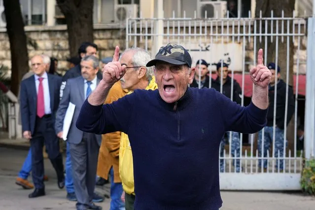 A Lebanese man chants slogans against Riad Salameh, Lebanon's Central Bank governor, in front of the Justice Palace in Beirut, Lebanon, Thursday, March 16, 2023. Lebanon's embattled Central Bank chief appeared Thursday for questioning for the first time before a European legal team visiting Beirut in a money-laundering probe linked to the governor. (Photo by Bilal Hussein/AP Photo)