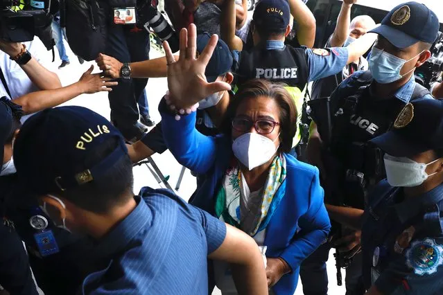 Detained former senator Leila De Lima (C) is escorted as she attends a court trial in Muntinlupa city, Metro Manila, Philippines, 27 February 2023. Leila De Lima, a staunch critic of former president Rodrigo Duterte, has been detained inside the Philippine National Police headquarters for the past six years facing two drug-related charges. (Photo by Francis R. Malasig/EPA/EFE/Rex Features/Shutterstock)
