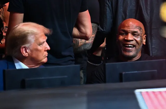 Former President Donald Trump talks with former US professional boxer Mike Tyson (R) as they attend the Ultimate Fighting Championship (UFC) 287 mixed martial arts event at the Kaseya Center in Miami, Florida, on April 8, 2023. (Photo by Chandan Khanna/AFP Photo)