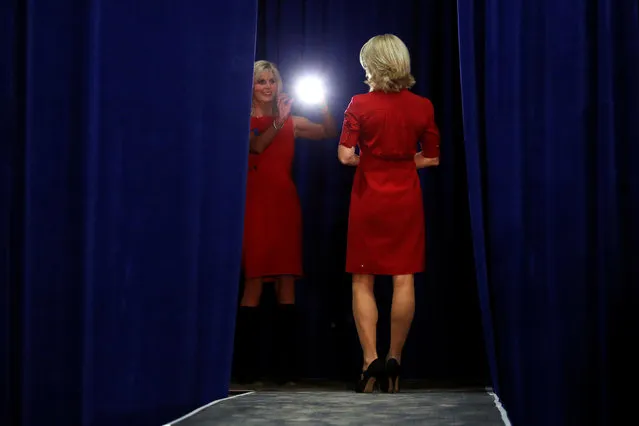 Two women take pictures on stage before Republican presidential nominee Donald Trump attends a campaign event in Springfield, Ohio, U.S., October 27 2016. (Photo by Carlo Allegri/Reuters)