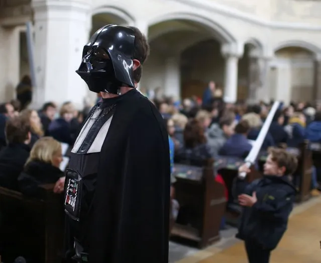 A person dressed as a character from the movie Star Wars attends a service at the church Zionskirche in Berlin, Germany, December 20, 2015. (Photo by Hannibal Hanschke/Reuters)