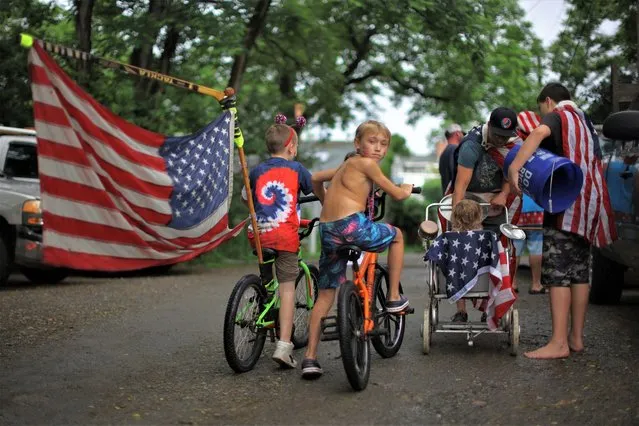 Boys on bikes lead residents' local Fourth of July Parade in the Lanesville neighborhood of Gloucester, Massachusetts, U.S., July 4, 2023. (Photo by Brian Snyder/Reuters)