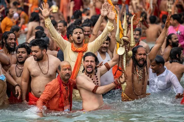 Sadhus, or Hindu holy men take a dip in the Ganges river during Shahi Snan at “Kumbh Mela”, or the Pitcher Festival, in Haridwar, India, April 12, 2021. (Photo by Danish Siddiqui/Reuters)