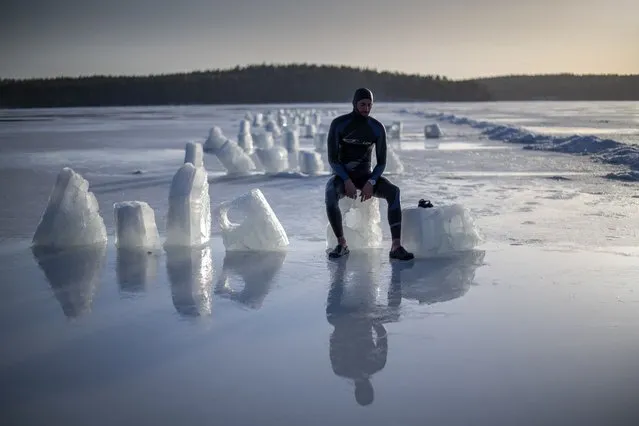 French freediver Arthur Guerin-Boeri,36, poses after establishing a new CMAS World record of Freediving under ice with wetsuit and no fins with a distance of 120m in 3 mn in Heinola on March 25, 2021. Air temp was +6C , water temp +2C. (Photo by Olivier Morin/AFP Photo)